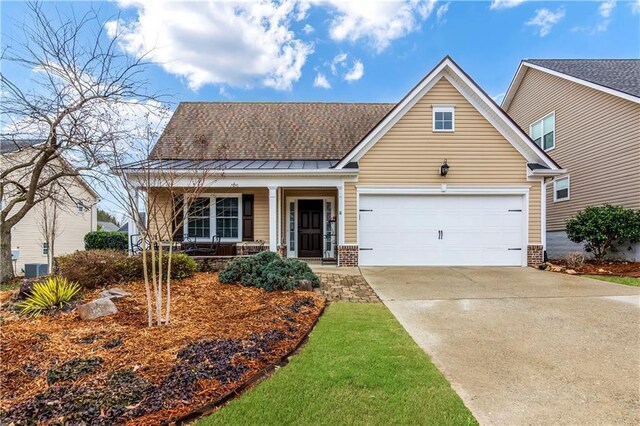 view of front of property with a porch and a garage