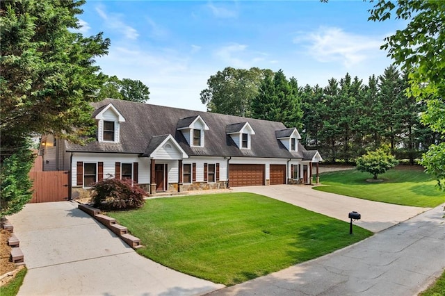 150 S St S, Buford, GA 30518 - cape cod house with concrete driveway, an attached garage, a gate, and stone siding