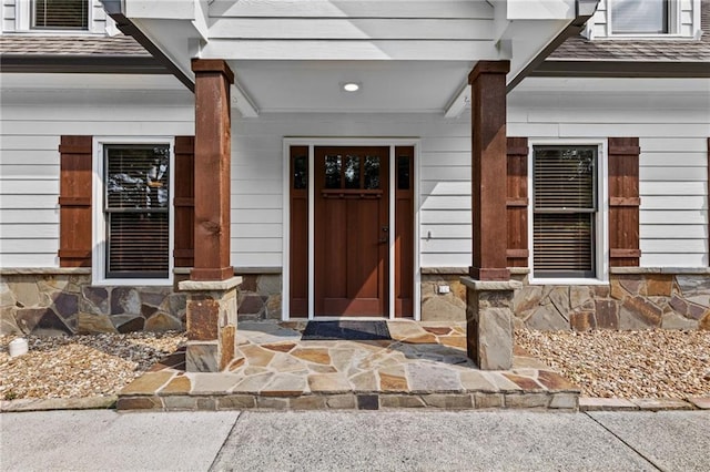 150 S St S, Buford, GA 30518 - doorway to property with roof with shingles and stone siding