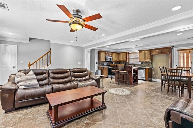 150 S St S, Buford, GA 30518 - living room featuring ornamental molding, recessed lighting, a ceiling fan, a textured ceiling, and light tile patterned floors