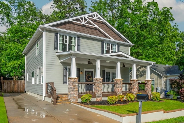 176 Olympic Pl, Decatur, GA 30030 - craftsman-style home with a porch, a ceiling fan, driveway, and stone siding
