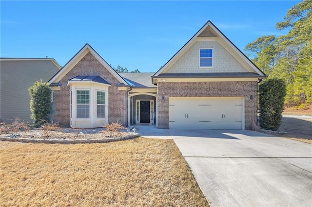 view of front of home featuring a garage and a front lawn