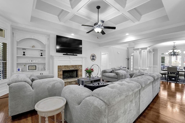 living room featuring dark wood-type flooring, coffered ceiling, beam ceiling, built in features, and a fireplace