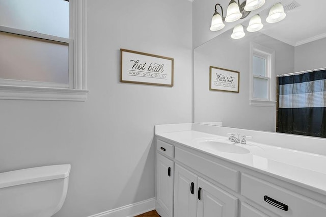 bathroom featuring vanity, toilet, and a shower with shower curtain