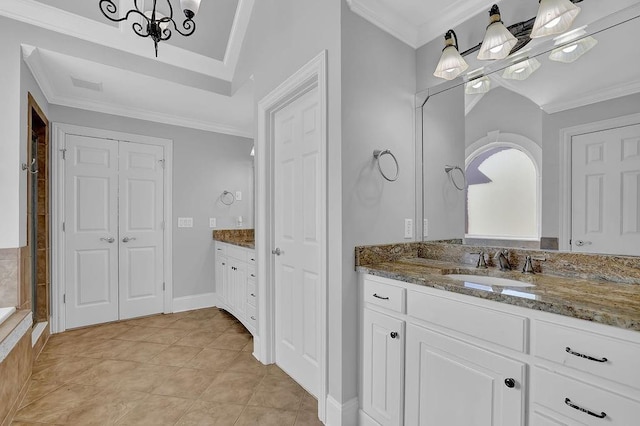 bathroom with tile patterned floors, ornamental molding, a chandelier, and vanity