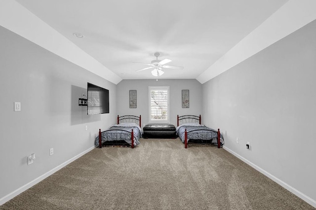 carpeted bedroom with vaulted ceiling and ceiling fan