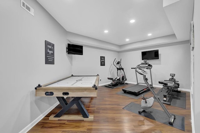 exercise room featuring hardwood / wood-style floors