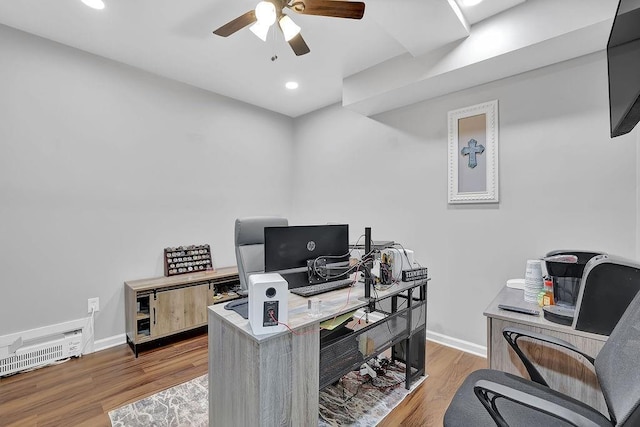 office featuring hardwood / wood-style flooring and ceiling fan