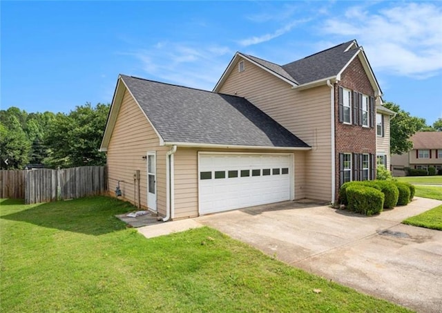 view of side of property featuring brick siding, a lawn, fence, a garage, and driveway