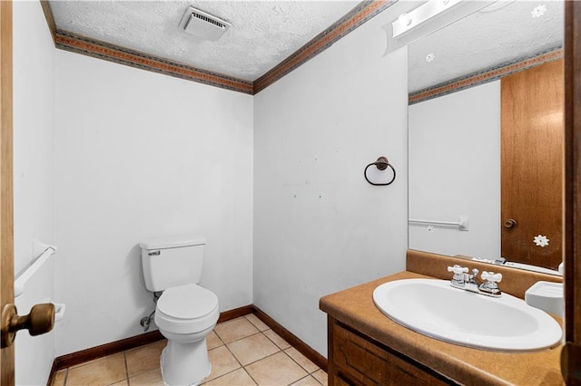 half bath with visible vents, toilet, tile patterned floors, a textured ceiling, and vanity