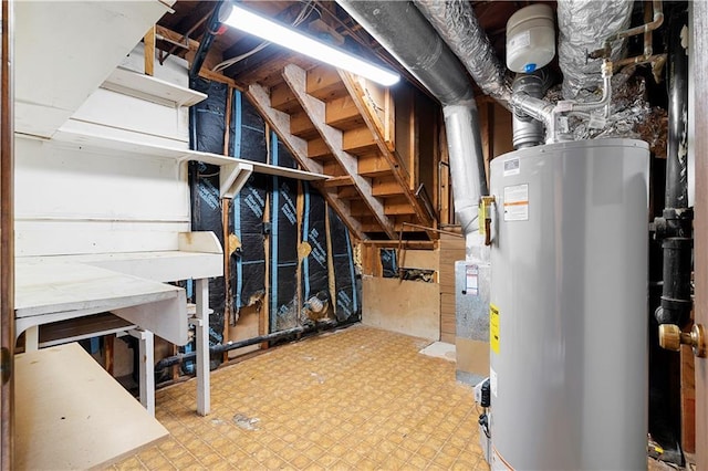 unfinished basement with water heater and tile patterned floors