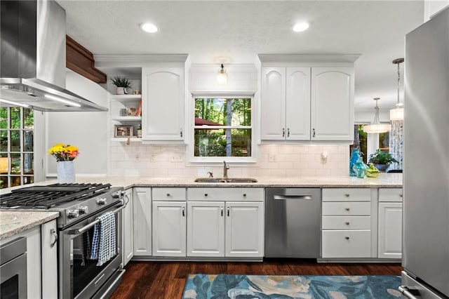 kitchen with open shelves, a sink, wall chimney exhaust hood, appliances with stainless steel finishes, and dark wood-style flooring