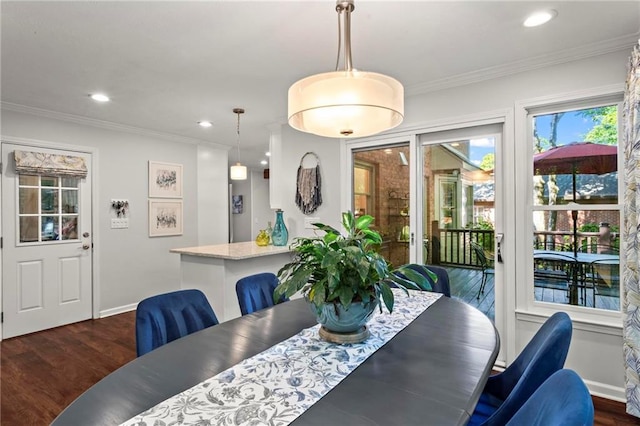 dining space featuring baseboards, recessed lighting, ornamental molding, and dark wood finished floors