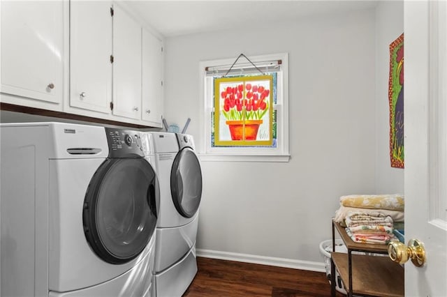 washroom with baseboards, dark wood-style flooring, cabinet space, and independent washer and dryer