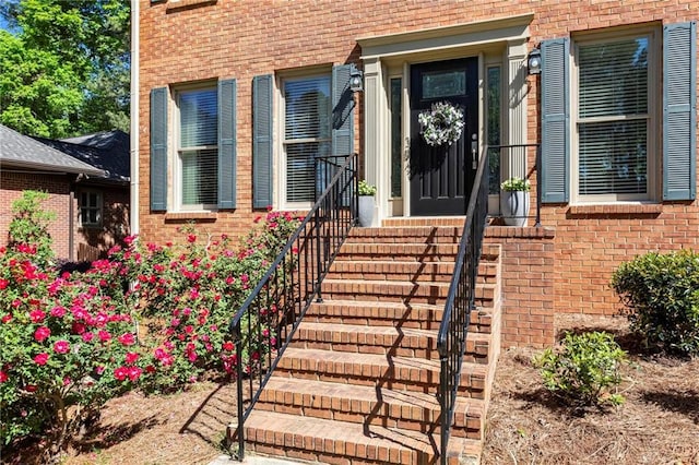 entrance to property with brick siding