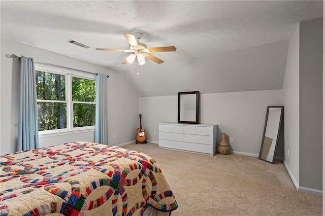 bedroom featuring baseboards, visible vents, carpet, lofted ceiling, and ceiling fan
