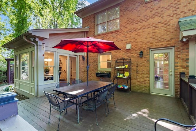 deck with outdoor dining area