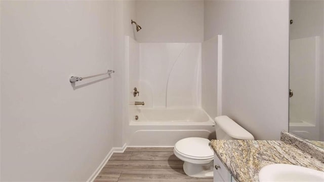 full bathroom with toilet, shower / bathtub combination, vanity, and wood-type flooring