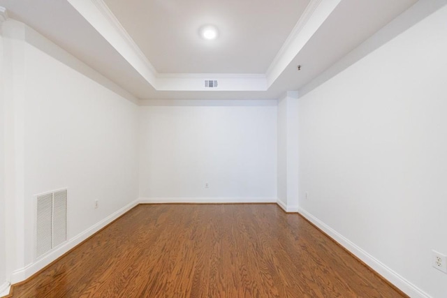 50 Biscayne Dr Unit 2106, Atlanta, GA 30309 - empty room featuring wood finished floors, a tray ceiling, baseboards, and ornamental molding