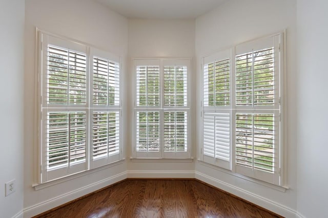50 Biscayne Dr Unit 2106, Atlanta, GA 30309 - empty room with wood finished floors, healthy amount of natural light, and baseboards