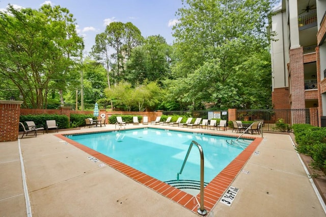 50 Biscayne Dr Unit 2106, Atlanta, GA 30309 - community pool with view of scattered trees and a patio area