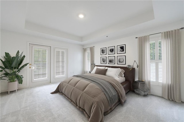 50 Biscayne Dr Unit 2106, Atlanta, GA 30309 - bedroom with a raised ceiling, light colored carpet, and access to outside