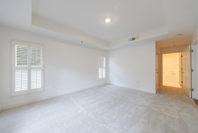 50 Biscayne Dr Unit 2106, Atlanta, GA 30309 - spare room with a tray ceiling, light carpet, and baseboards