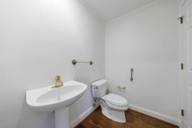 50 Biscayne Dr Unit 2106, Atlanta, GA 30309 - half bath featuring crown molding, wood finished floors, toilet, and baseboards