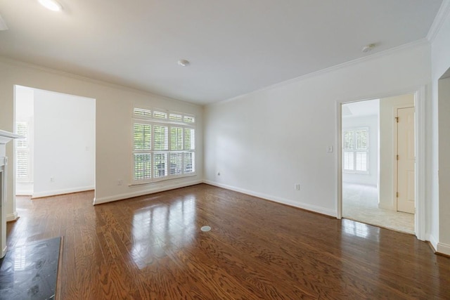 50 Biscayne Dr Unit 2106, Atlanta, GA 30309 - unfurnished living room featuring crown molding, wood finished floors, baseboards, and a fireplace with raised hearth