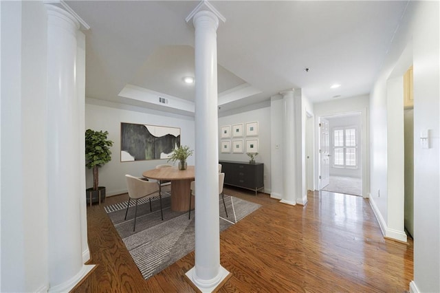 50 Biscayne Dr Unit 2106, Atlanta, GA 30309 - corridor with decorative columns, wood finished floors, a raised ceiling, baseboards, and recessed lighting