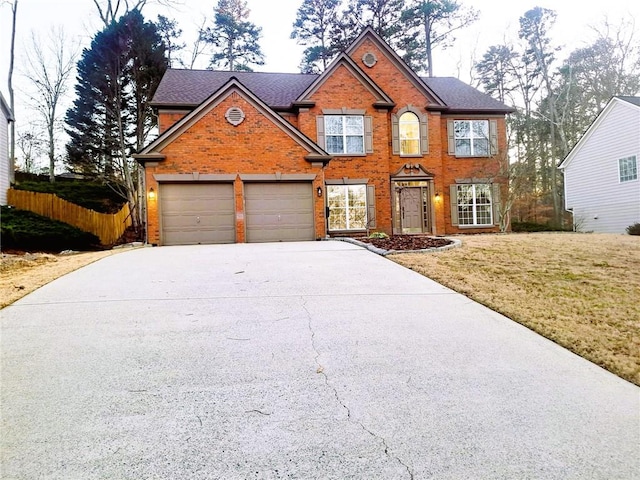 view of front of home with a garage and a front yard