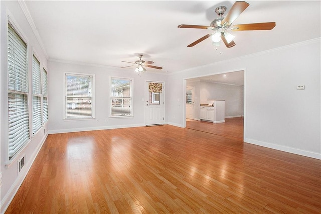 unfurnished living room with crown molding, ceiling fan, and light hardwood / wood-style floors