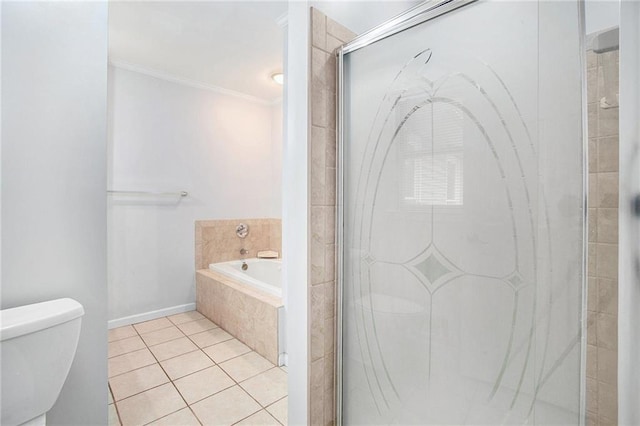 bathroom featuring crown molding, toilet, tile patterned flooring, and plus walk in shower