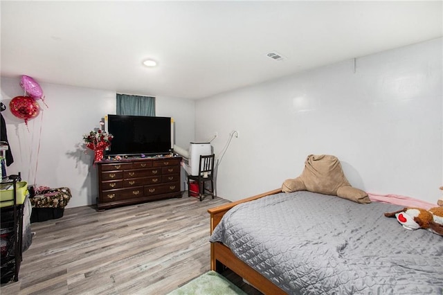 bedroom featuring light wood-type flooring