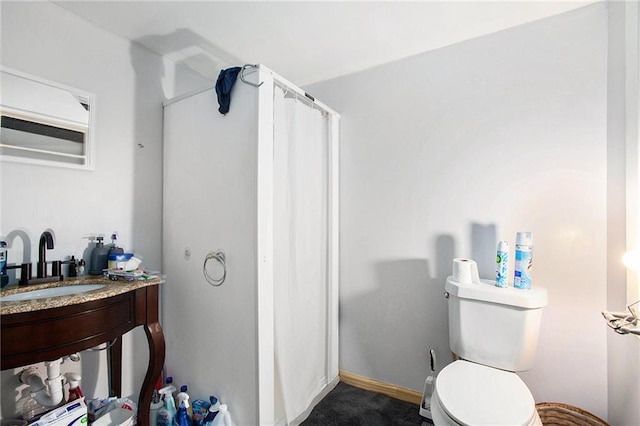 bathroom featuring toilet and sink