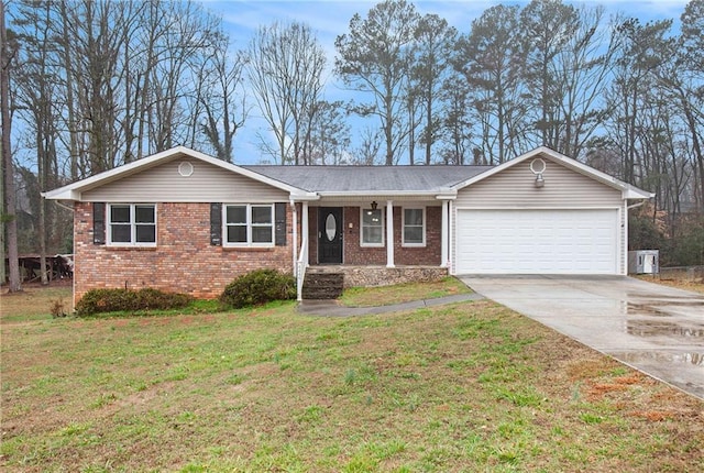 single story home featuring a garage and a front yard