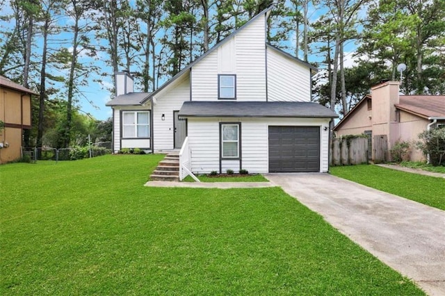 view of front of home with a front yard and a garage