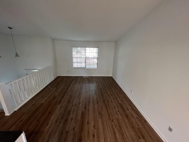 981 Dundee Dr, Lilburn, GA 30047 - empty room with baseboards and dark wood-type flooring