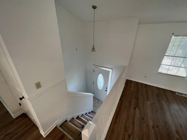 981 Dundee Dr, Lilburn, GA 30047 - entrance foyer with stairway, baseboards, dark wood-type flooring, and visible vents