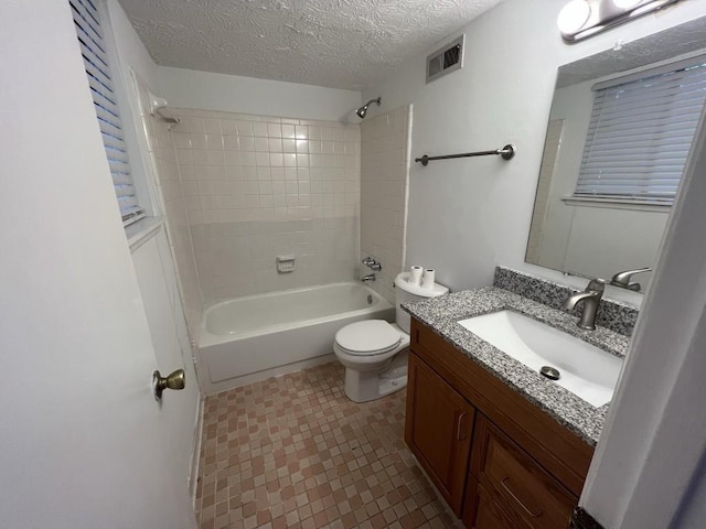 981 Dundee Dr, Lilburn, GA 30047 - bathroom featuring bathing tub / shower combination, visible vents, toilet, vanity, and a textured ceiling