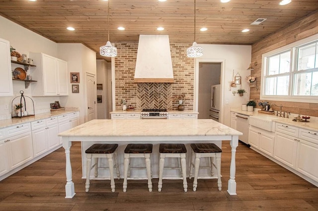 kitchen featuring a sink, open shelves, wooden ceiling, wall chimney range hood, and high end appliances