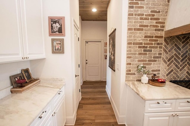 corridor with recessed lighting, wooden ceiling, baseboards, and wood finished floors