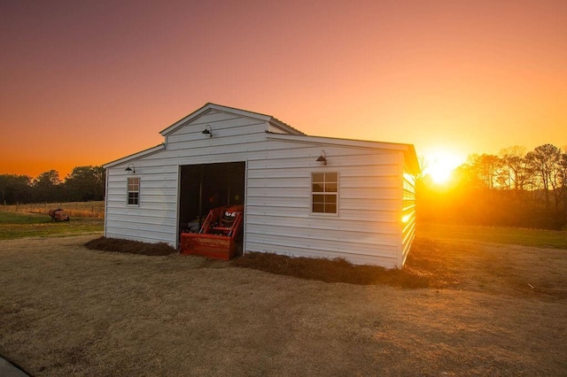 view of outdoor structure featuring an outbuilding and a garage