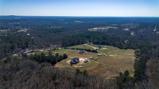 aerial view with a rural view and a view of trees