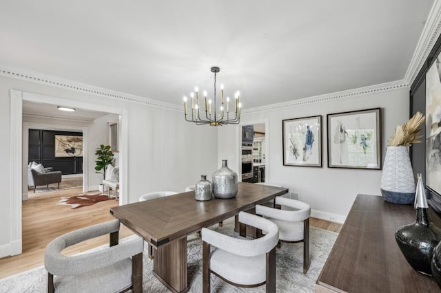 6124 Kings Mountain Ct, Stone Mountain, GA 30087 - dining space featuring baseboards, ornamental molding, an inviting chandelier, and light wood finished floors