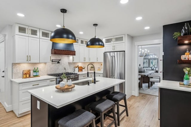 6124 Kings Mountain Ct, Stone Mountain, GA 30087 - kitchen featuring light countertops, stove, a sink, white cabinets, and high quality fridge