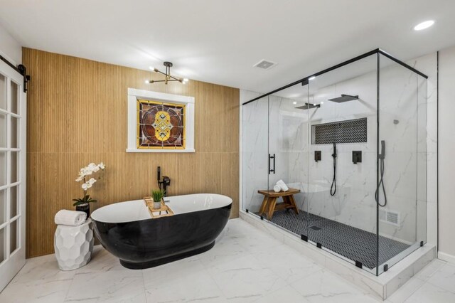 6124 Kings Mountain Ct, Stone Mountain, GA 30087 - full bathroom featuring a freestanding tub, a marble finish shower, wood walls, marble finish floor, and visible vents