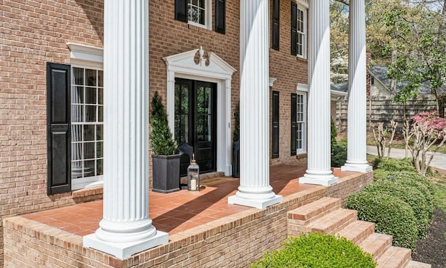 6124 Kings Mountain Ct, Stone Mountain, GA 30087 - doorway to property with brick siding and a porch