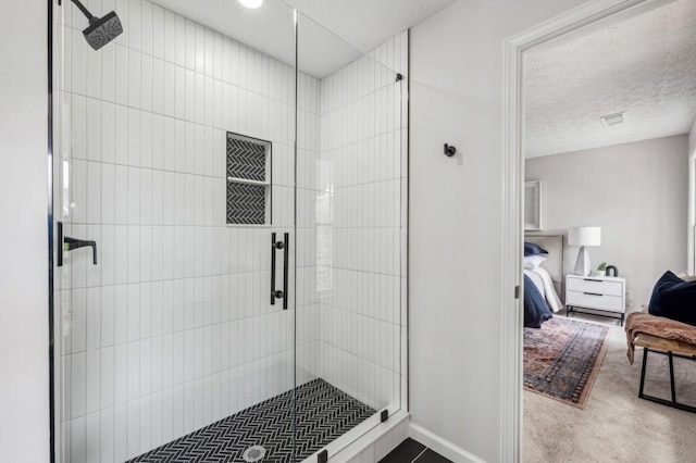 6124 Kings Mountain Ct, Stone Mountain, GA 30087 - bathroom with a textured ceiling, visible vents, a shower stall, baseboards, and ensuite bath