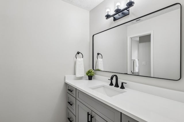 6124 Kings Mountain Ct, Stone Mountain, GA 30087 - bathroom with vanity and a textured ceiling